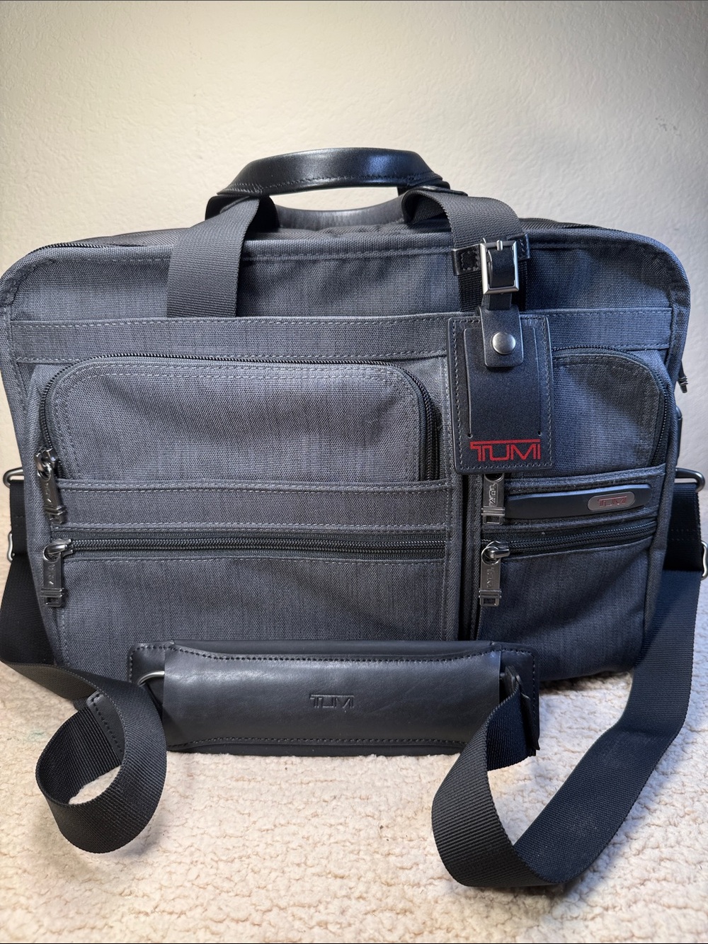 Tumi Black and Dark Gray Men's Laptop Briefcase with Red Logo Accent